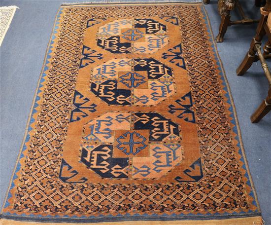 A Tekke red ground rug, with field of three octagons 170 x 121cm